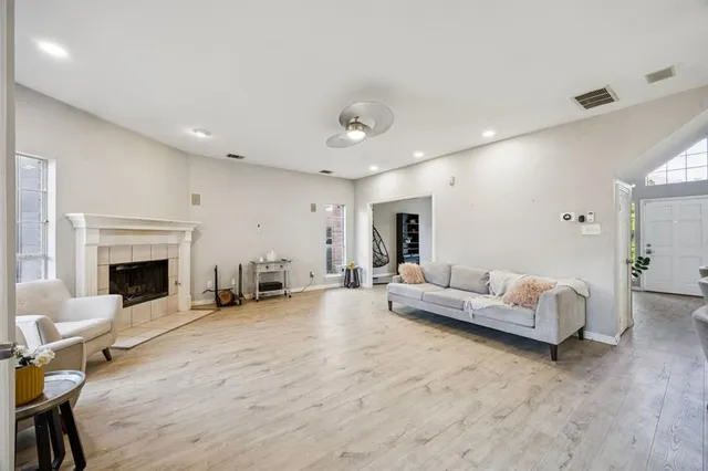 a living room with furniture and a fireplace