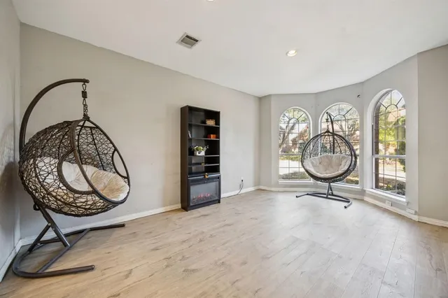 a view of a room with gym equipment and a window