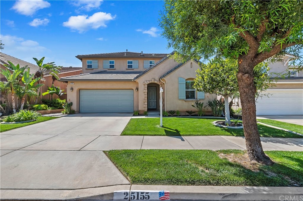25155 Coral Canyon Road Corona, CA 92883 - Photo 1 of 1 a front view of a house with a yard and garage