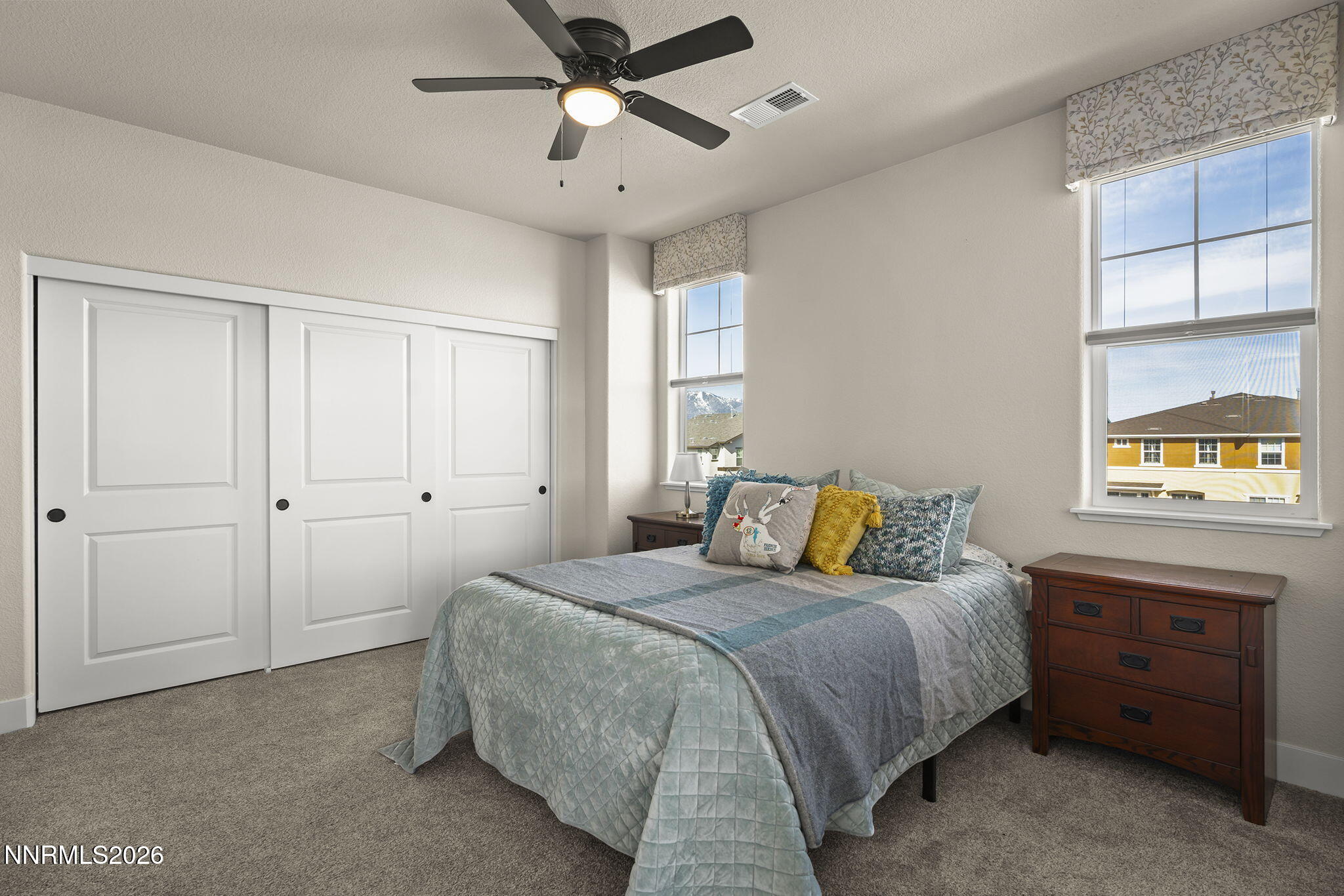 300 Cattail Circle Gardnerville, NV 89410 - Photo 12 of 39 a bedroom with a bed and a chandelier