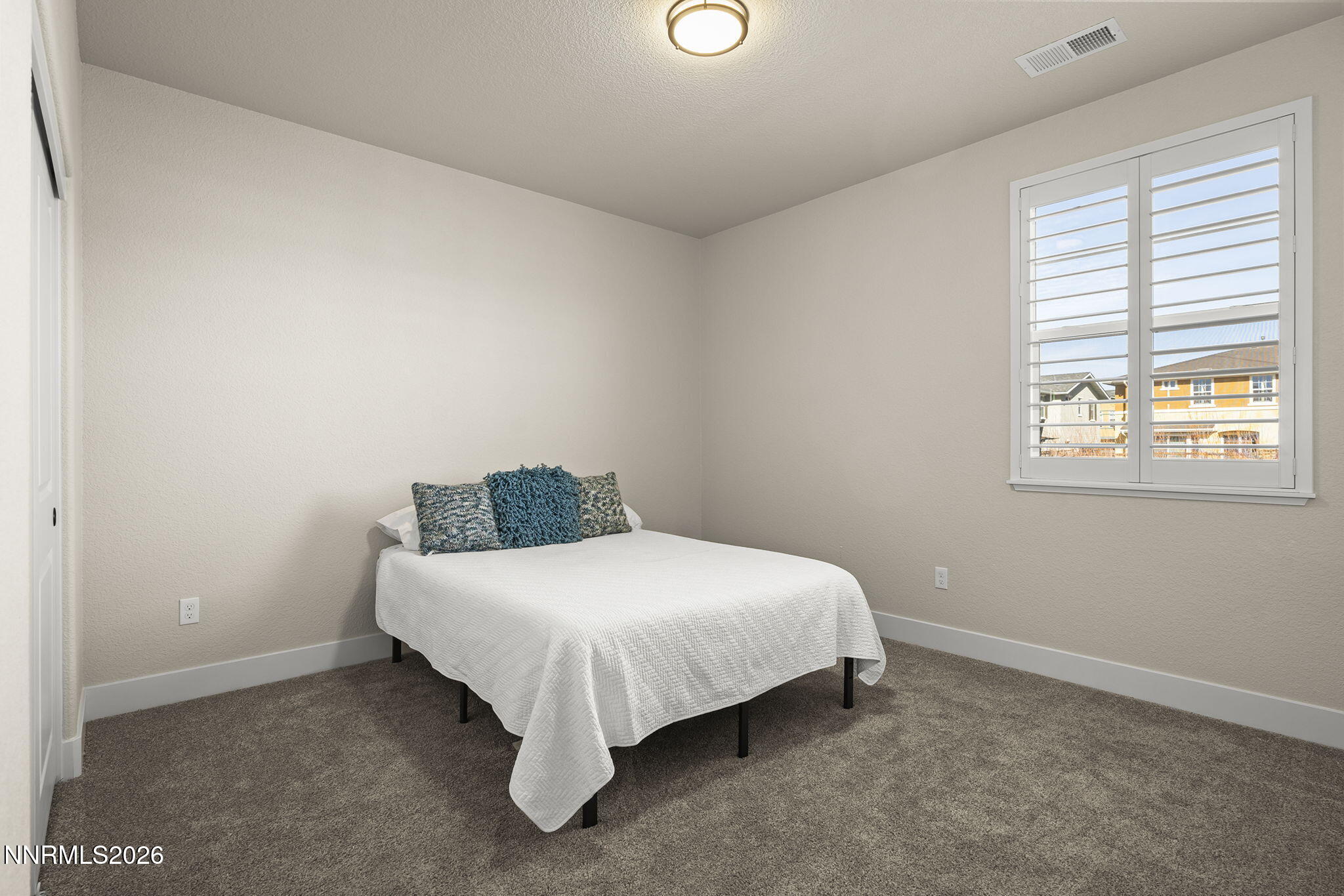 300 Cattail Circle Gardnerville, NV 89410 - Photo 16 of 39 a large bed sitting in a bedroom next to a window