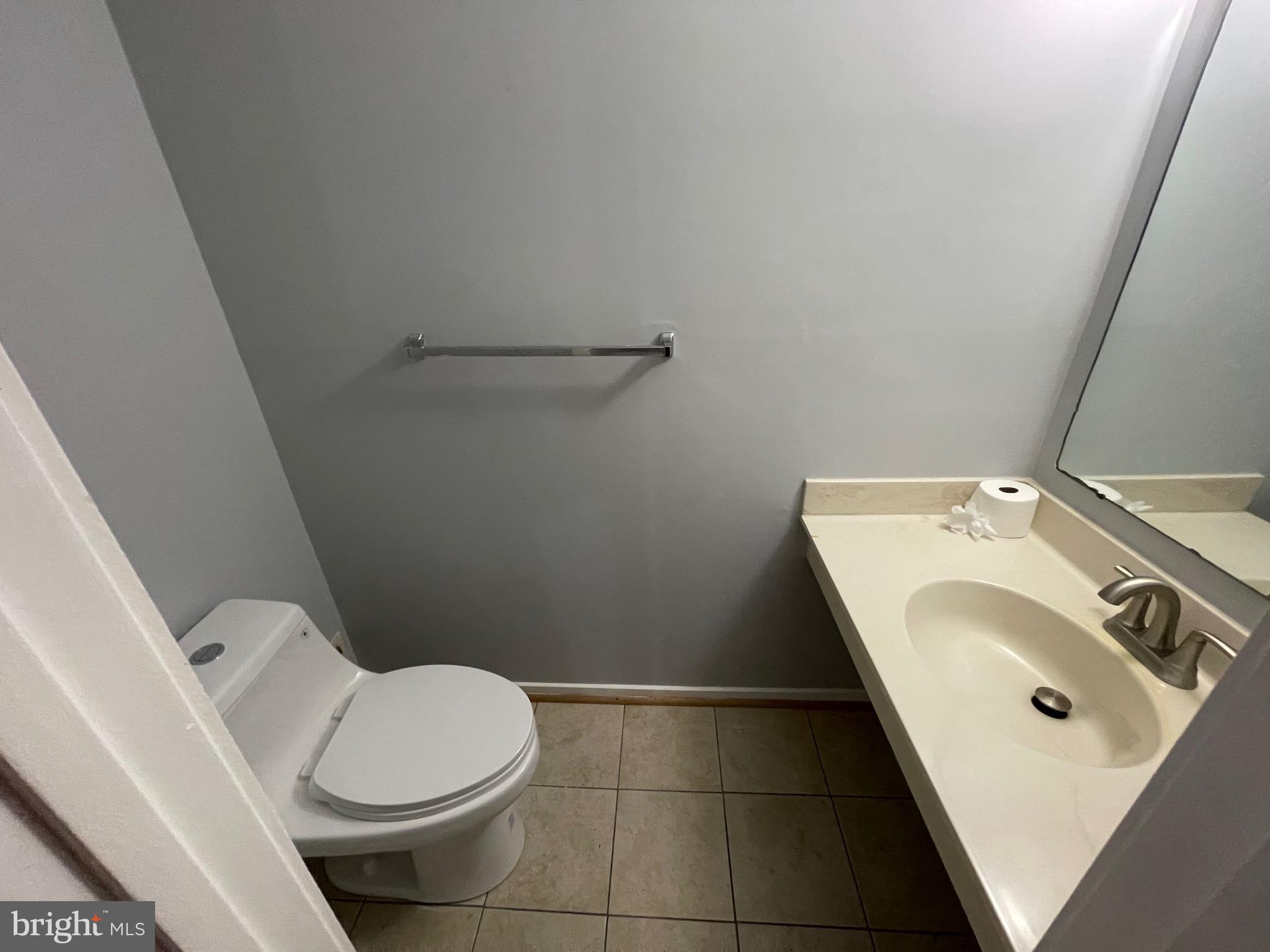 9815 Hellingly Place, Unit 75 Montgomery Village, MD 20886 - Photo 2 of 14 a bathroom with a sink and a toilet