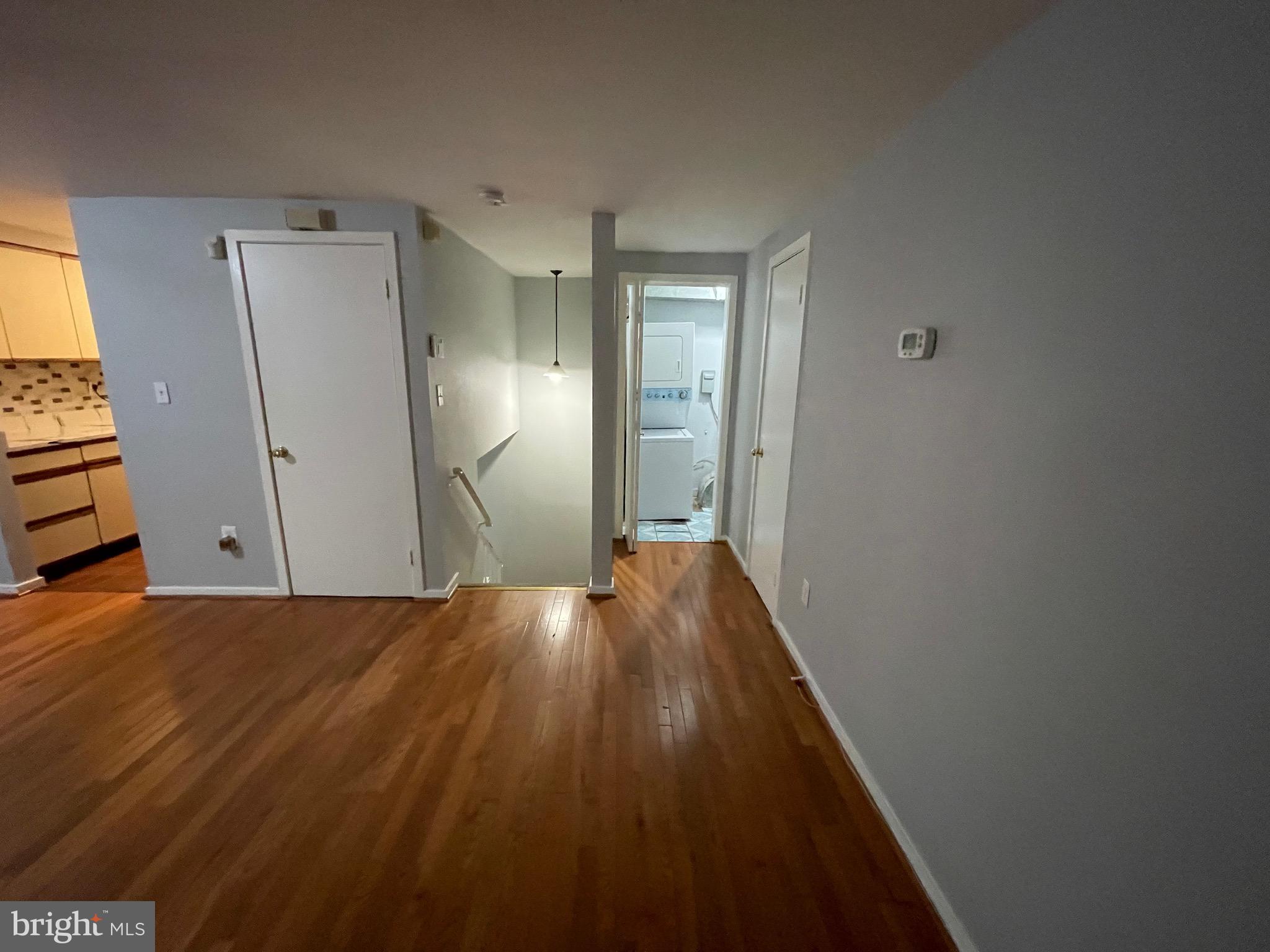 9815 Hellingly Place, Unit 75 Montgomery Village, MD 20886 - Photo 7 of 14 a view of hallway with wooden floor
