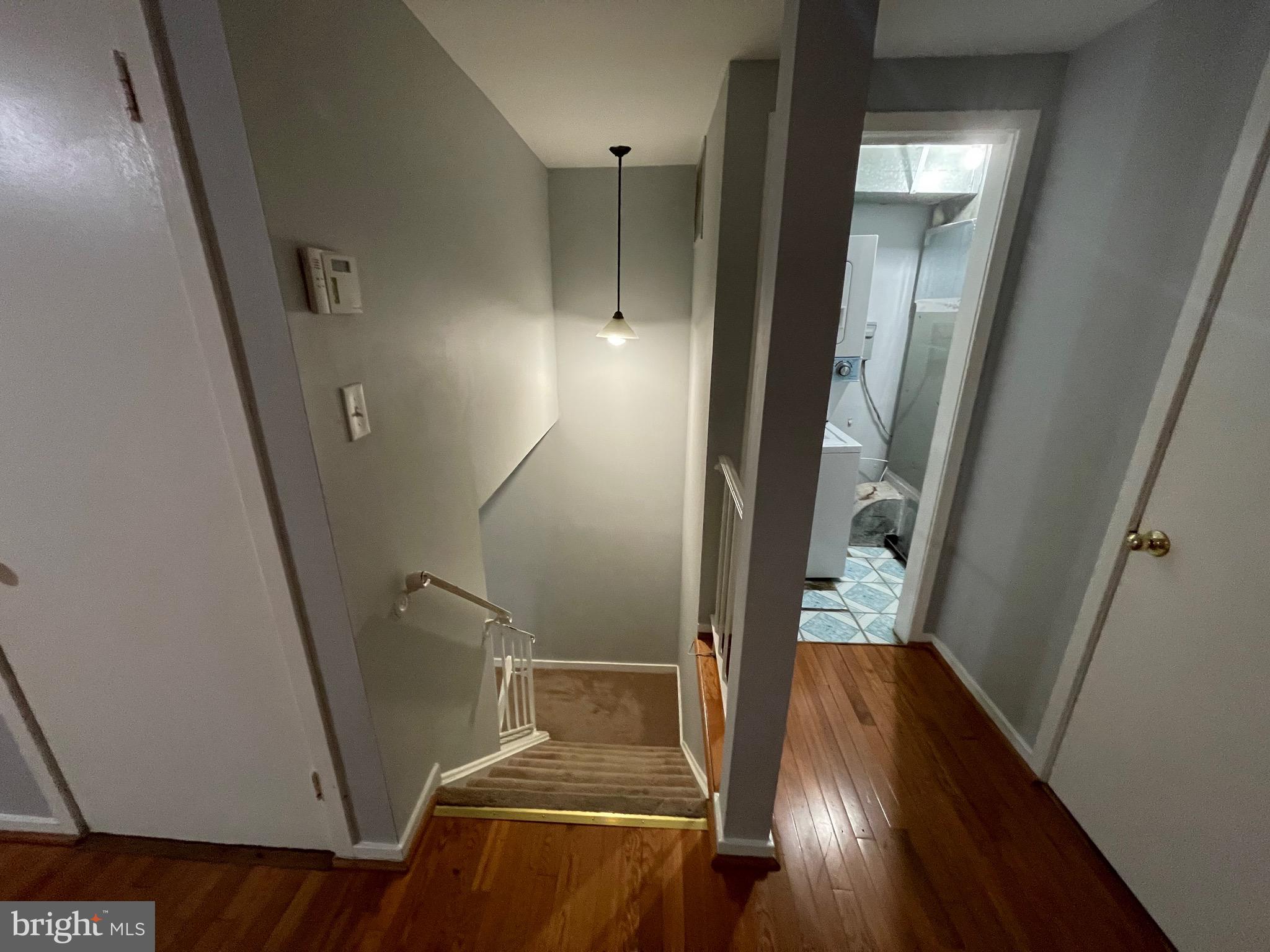 9815 Hellingly Place, Unit 75 Montgomery Village, MD 20886 - Photo 8 of 14 a view of entryway and hall with wooden floor