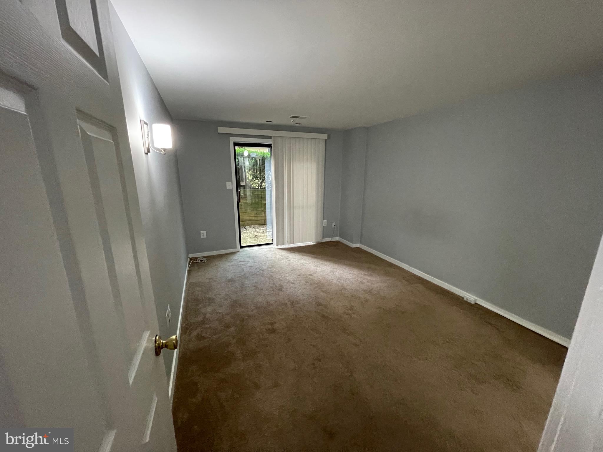 9815 Hellingly Place, Unit 75 Montgomery Village, MD 20886 - Photo 9 of 14 an empty room with windows