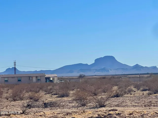 a view of ocean with a mountain