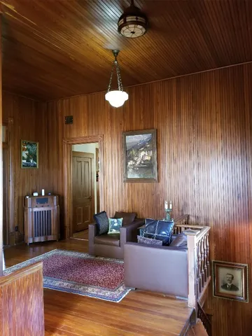 a view of an entryway with wooden floor