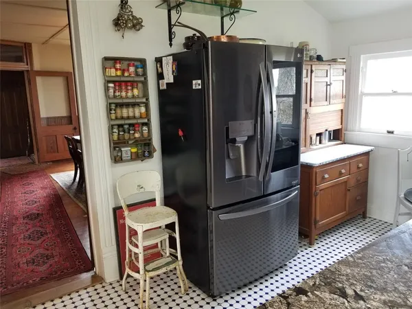 a kitchen with granite countertop a sink a counter top space and a window