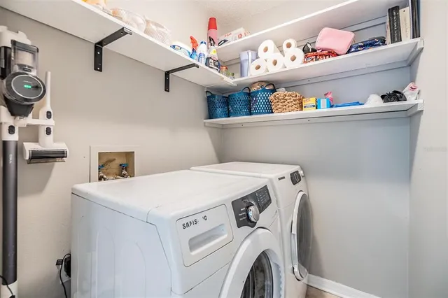 a utility room with dryer and washer