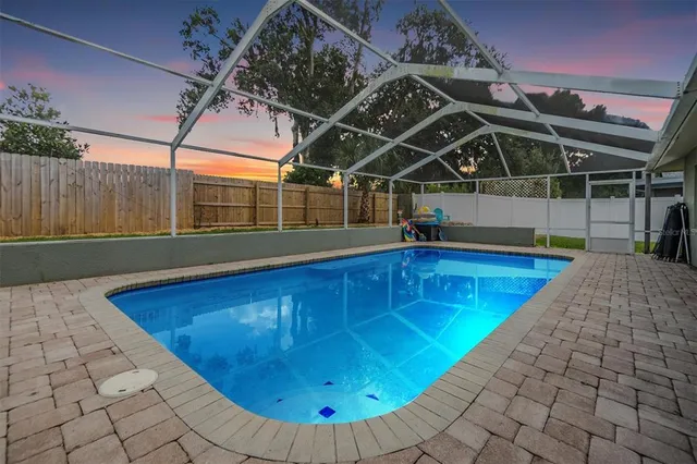 a view of a swimming pool with a patio