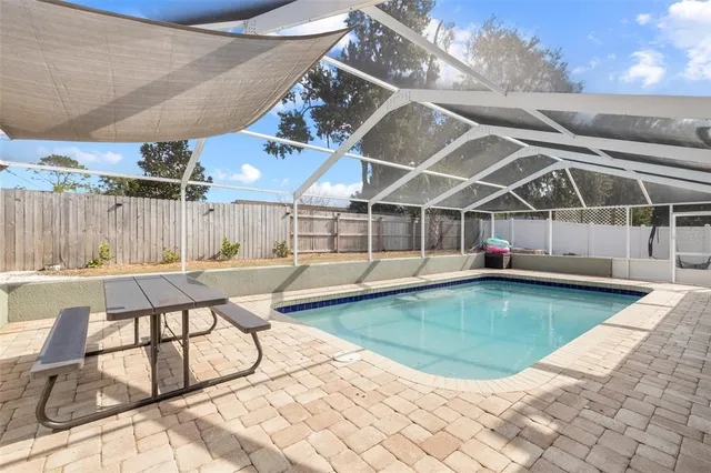 a view of a swimming pool with a patio