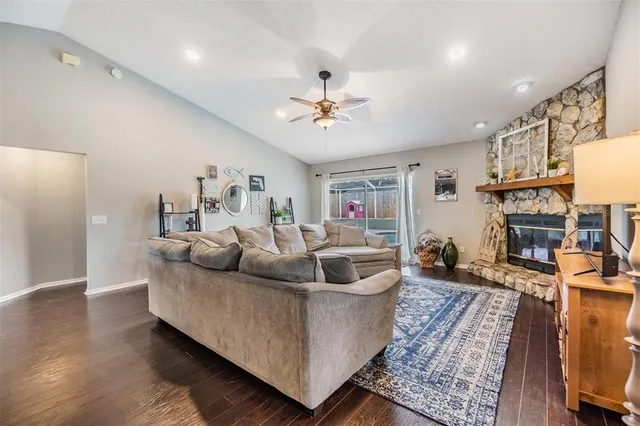 a living room with furniture and a fireplace