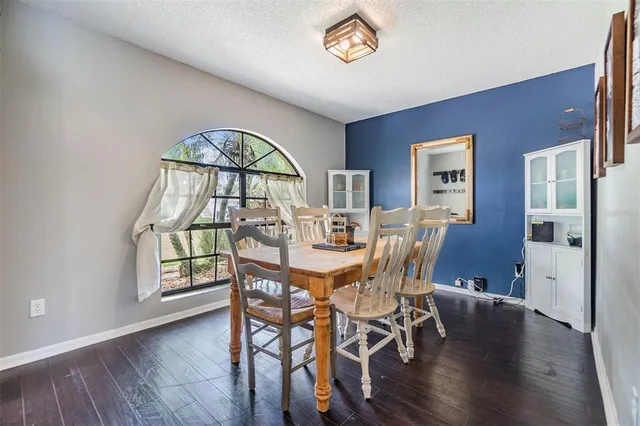 a view of a livingroom with furniture and a window