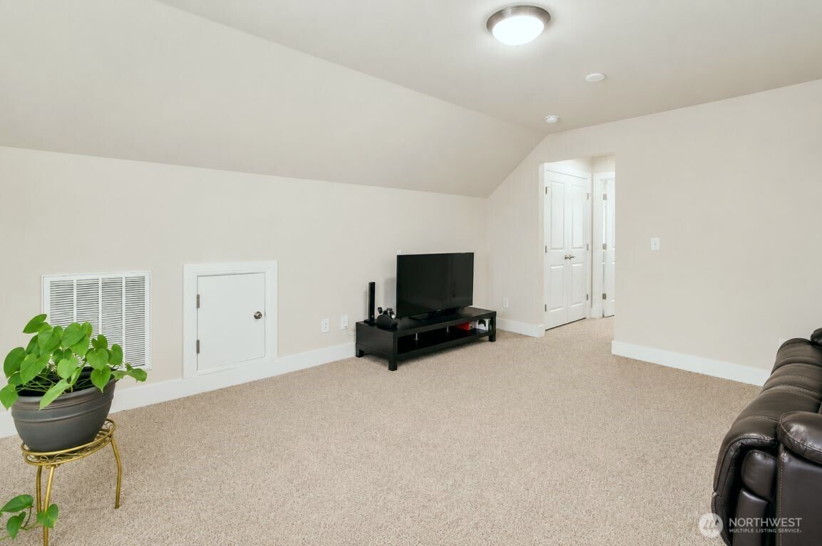 19607 25th Drive Southeast Bothell, WA 98012 - Photo 23 of 30 a living room with furniture and a flat screen tv