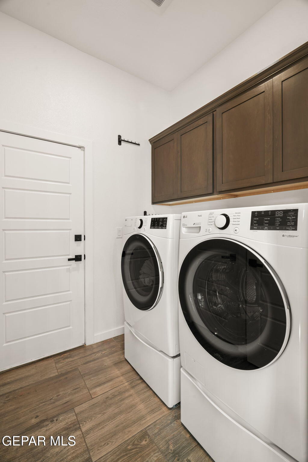 13070 Beccles Street El Paso, TX 79928 - Photo 11 of 43 a utility room with dryer and washer