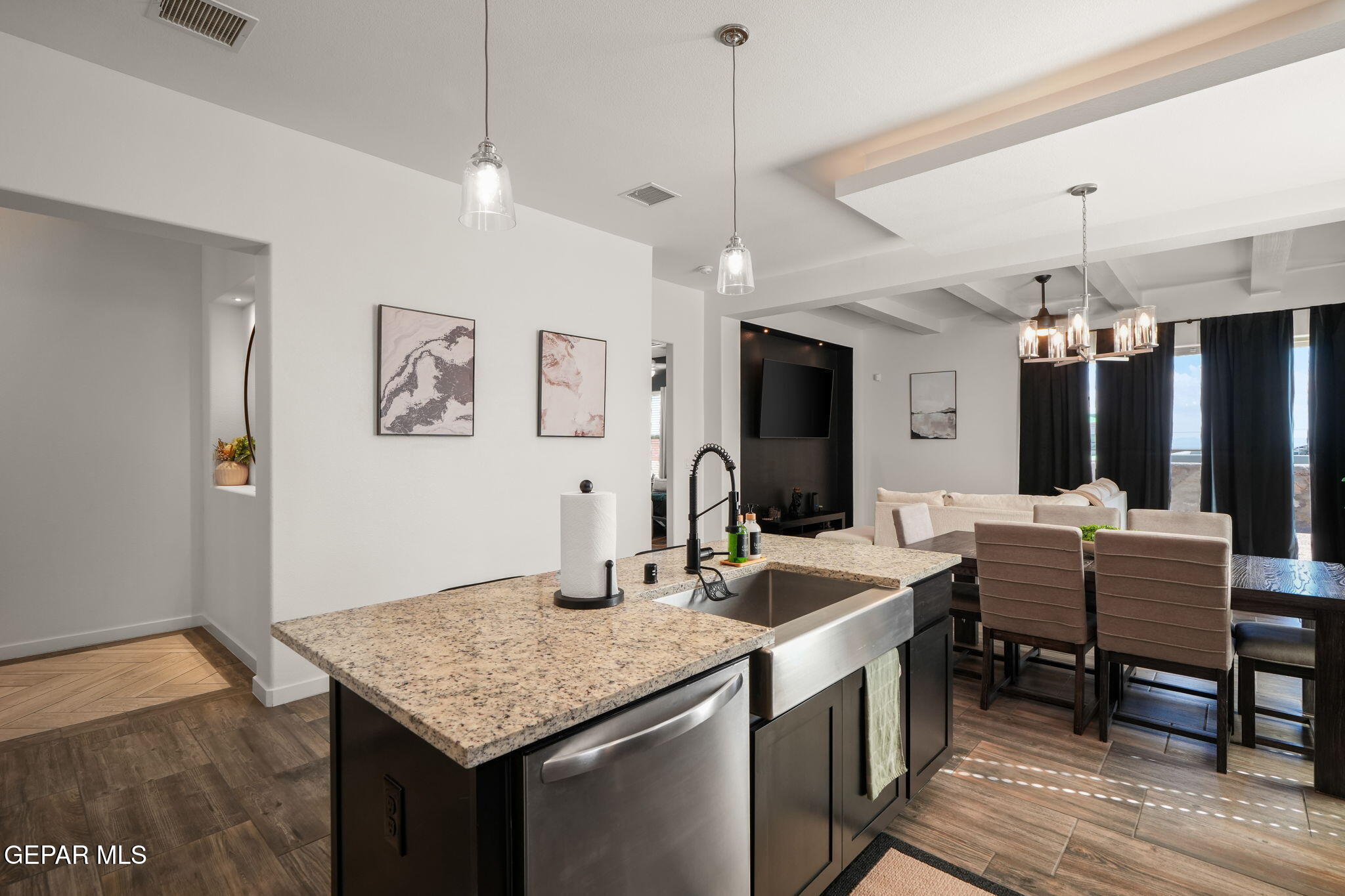 13070 Beccles Street El Paso, TX 79928 - Photo 13 of 43 a kitchen with sink cabinets and wooden floor