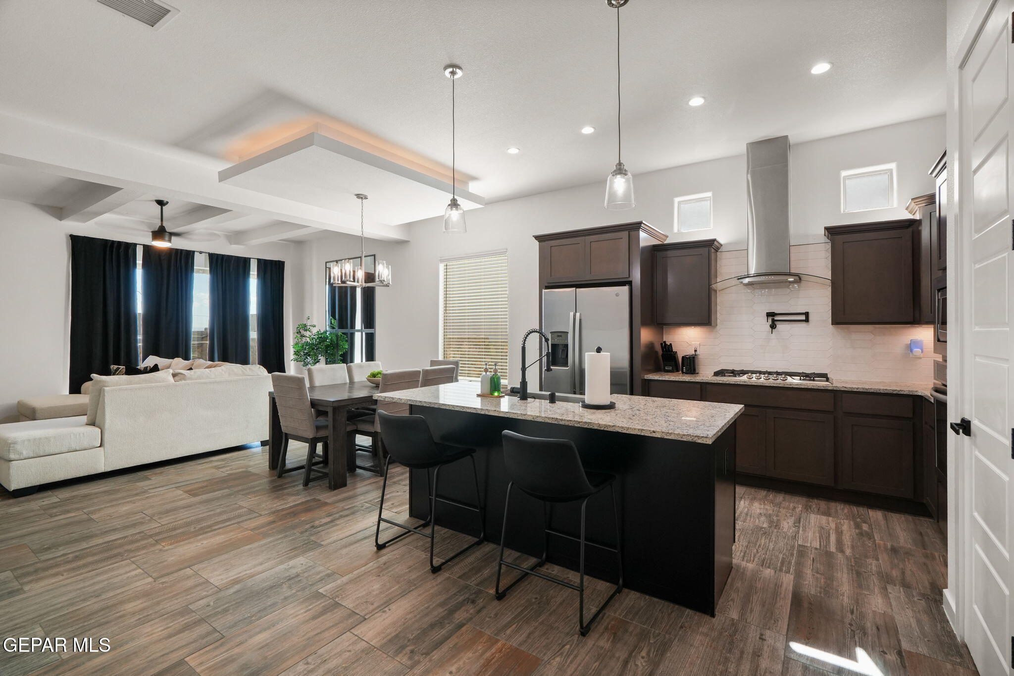 13070 Beccles Street El Paso, TX 79928 - Photo 14 of 43 a kitchen with counter space dining table and chairs