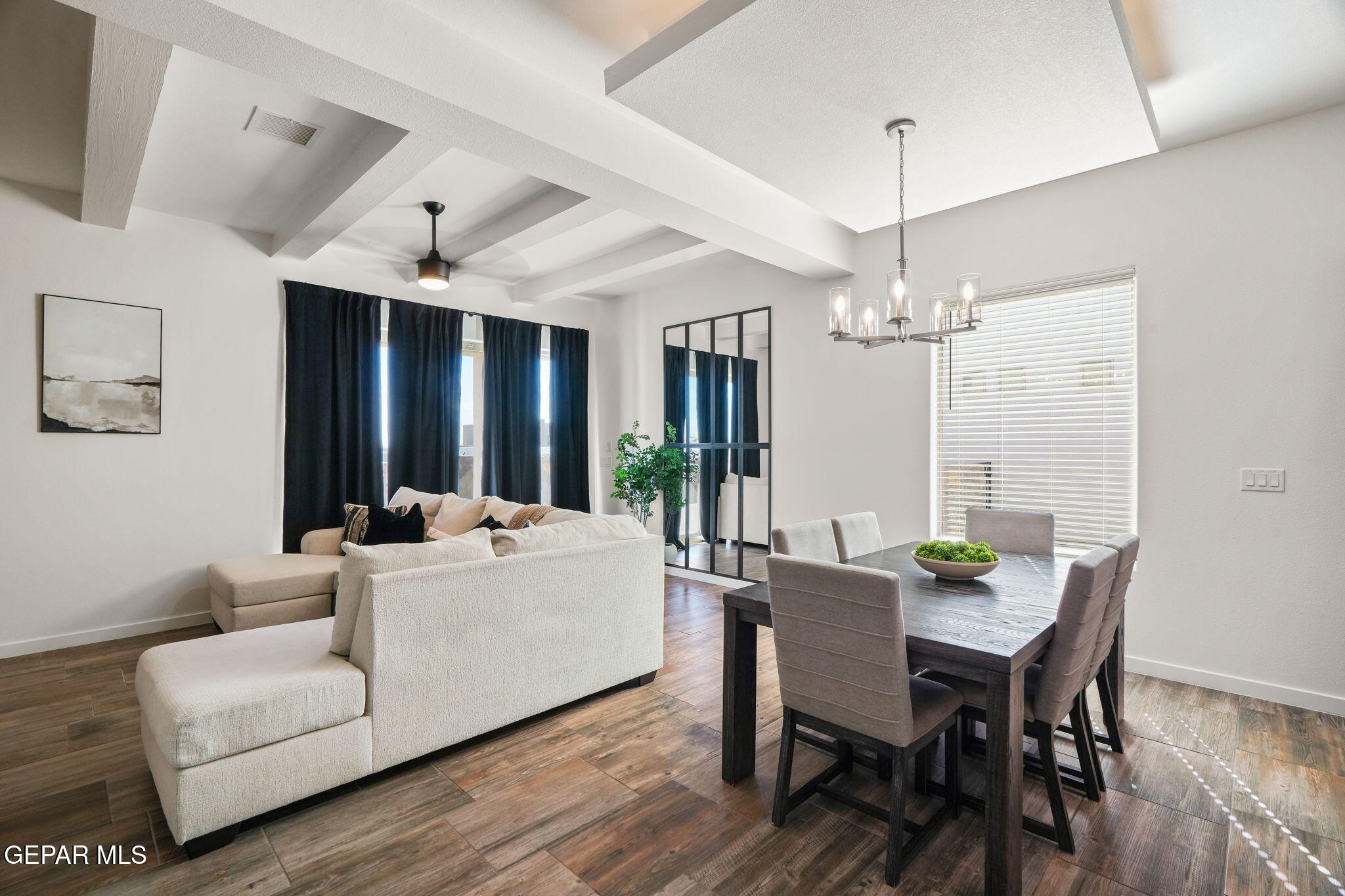 13070 Beccles Street El Paso, TX 79928 - Photo 17 of 43 a living room with furniture a table and a chandelier