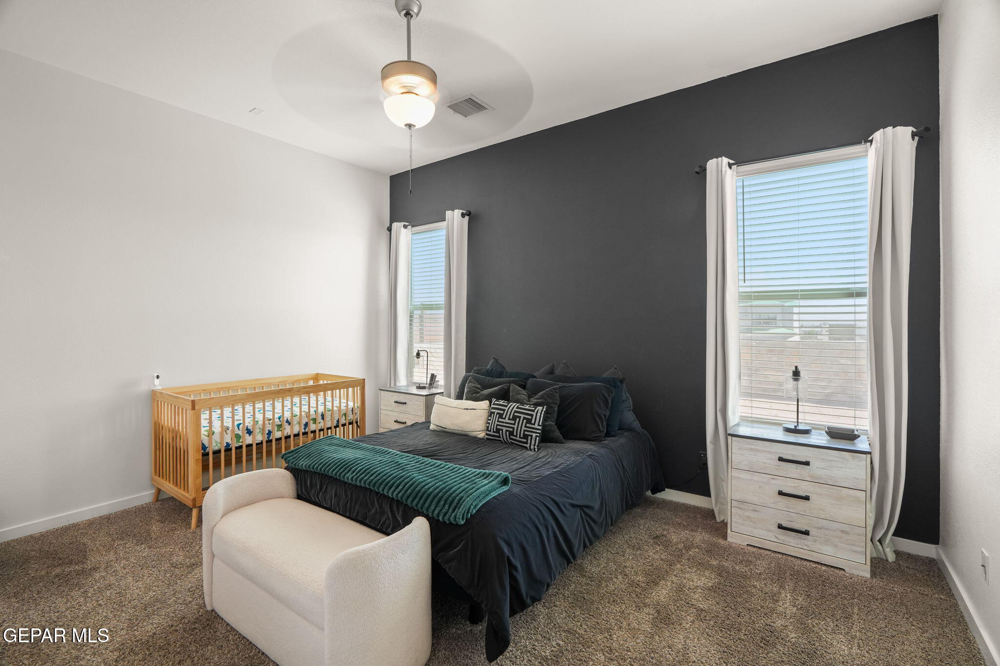 13070 Beccles Street El Paso, TX 79928 - Photo 23 of 43 a spacious bedroom with a bed and a couch