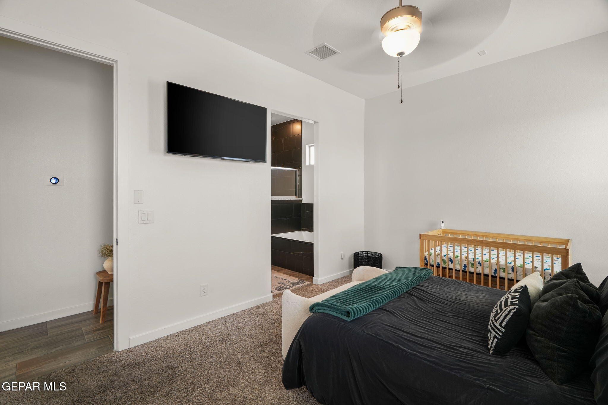 13070 Beccles Street El Paso, TX 79928 - Photo 24 of 43 a bedroom with a bed and a television