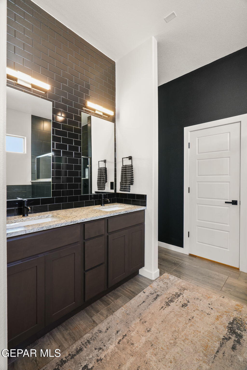 13070 Beccles Street El Paso, TX 79928 - Photo 26 of 43 a bathroom with a sink and a mirror