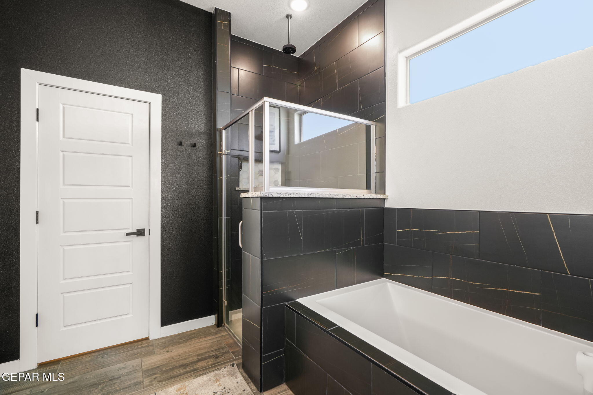 13070 Beccles Street El Paso, TX 79928 - Photo 28 of 43 a bathroom with a sink and a shower
