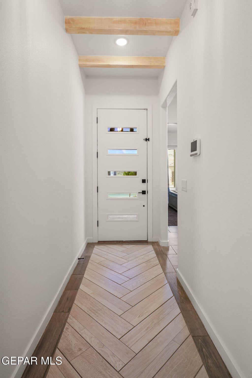13070 Beccles Street El Paso, TX 79928 - Photo 4 of 43 a view of a hallway with wooden floor