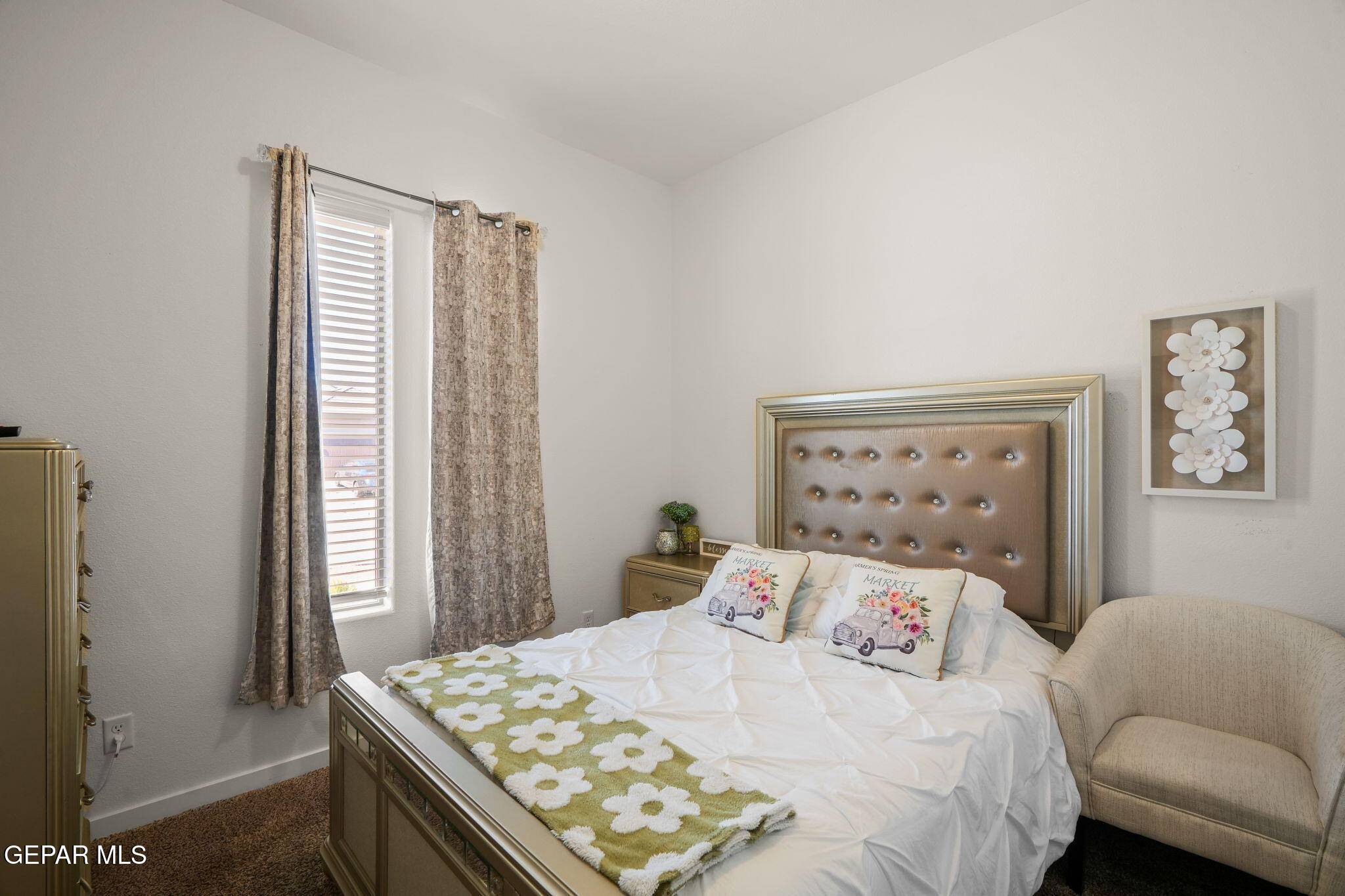13070 Beccles Street El Paso, TX 79928 - Photo 5 of 43 a bedroom with a bed and a dresser next to a window