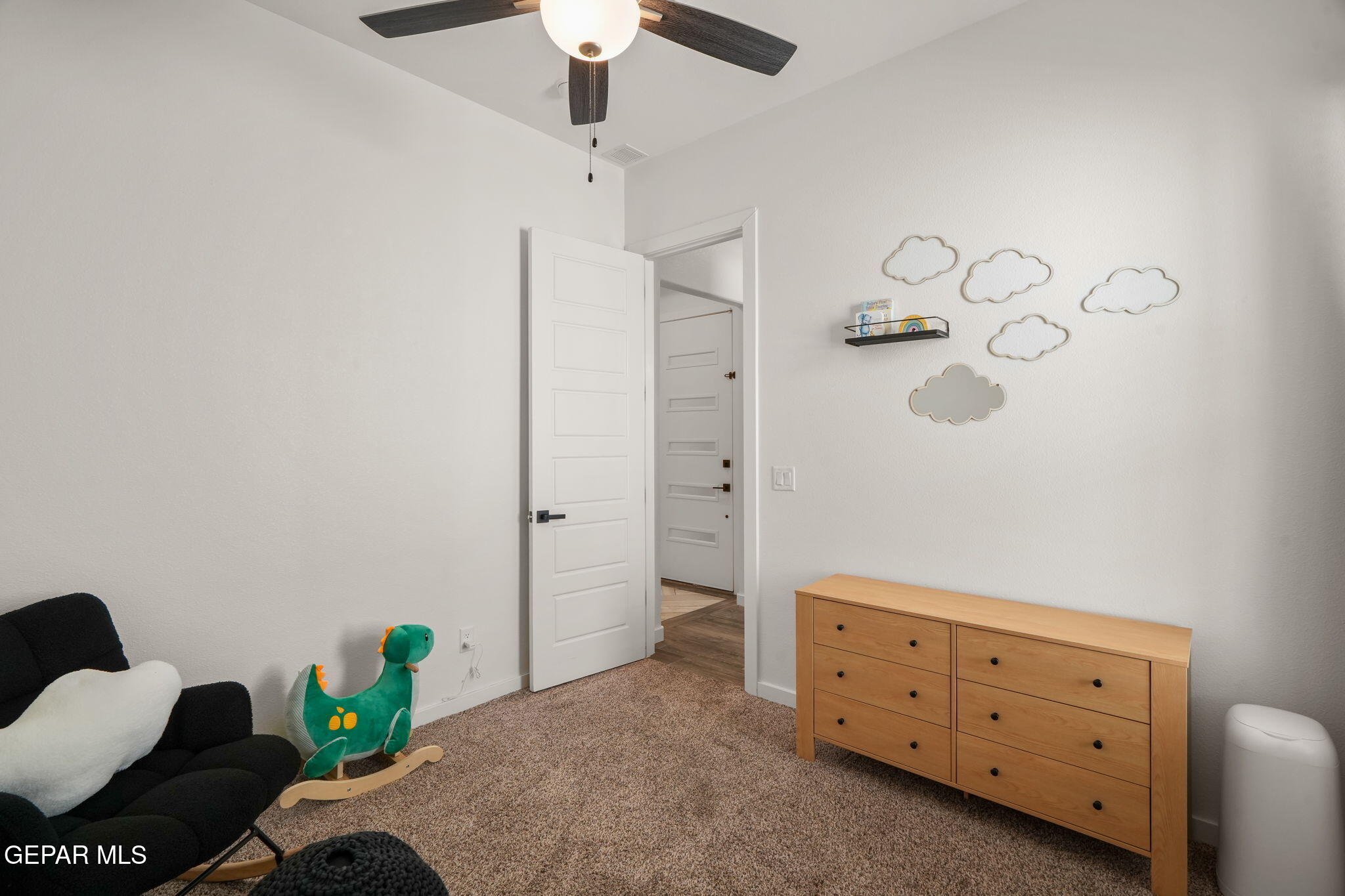 13070 Beccles Street El Paso, TX 79928 - Photo 10 of 43 a bedroom with a bed and a dresser