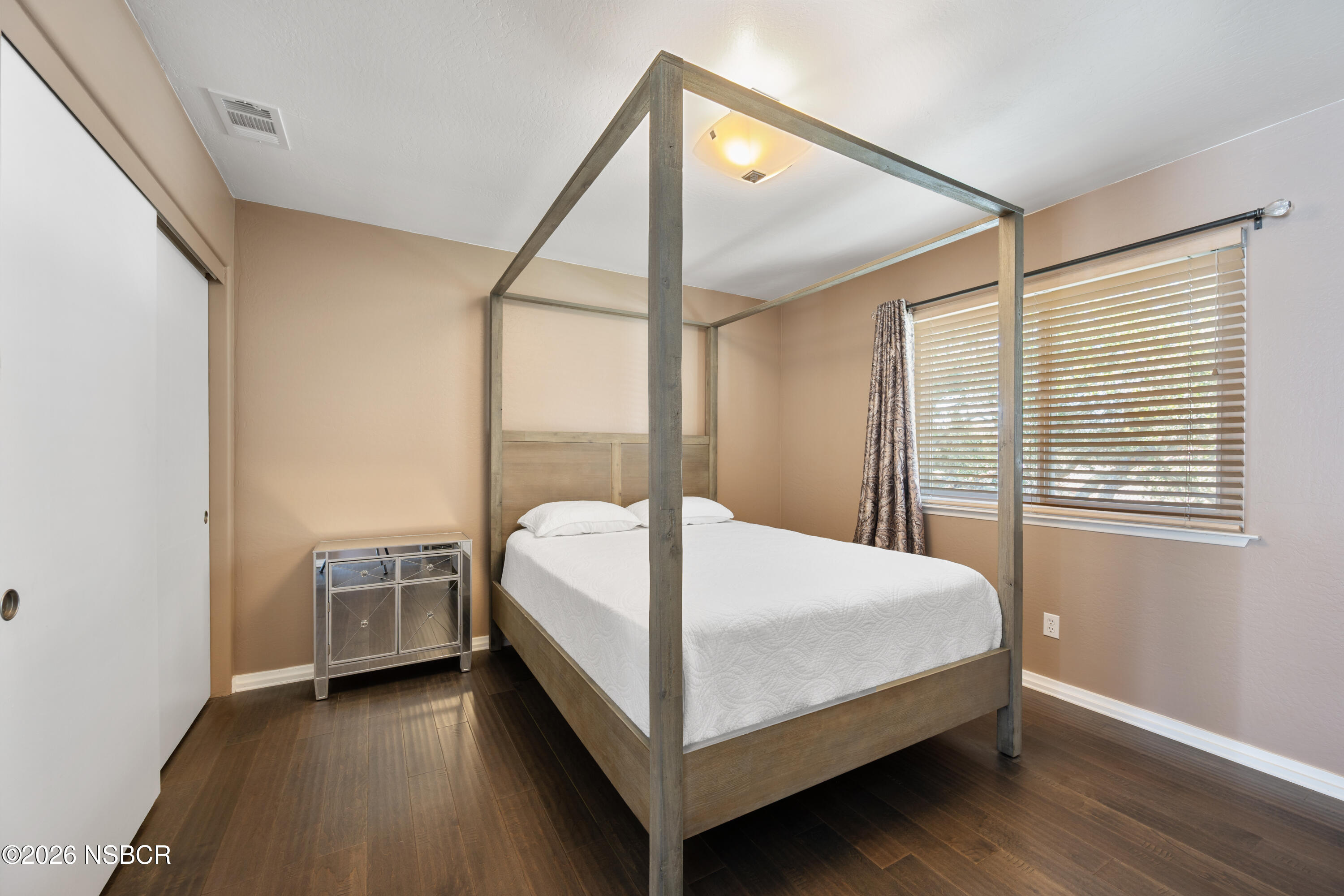4473 Greenbrier Road Lompoc, CA 93436 - Photo 30 of 54 a bed sitting in a bedroom next to a window