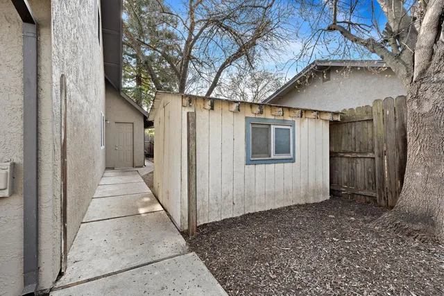 a view of a house with a tree