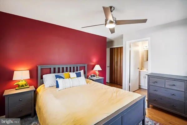 a bed room with a bed and a dresser