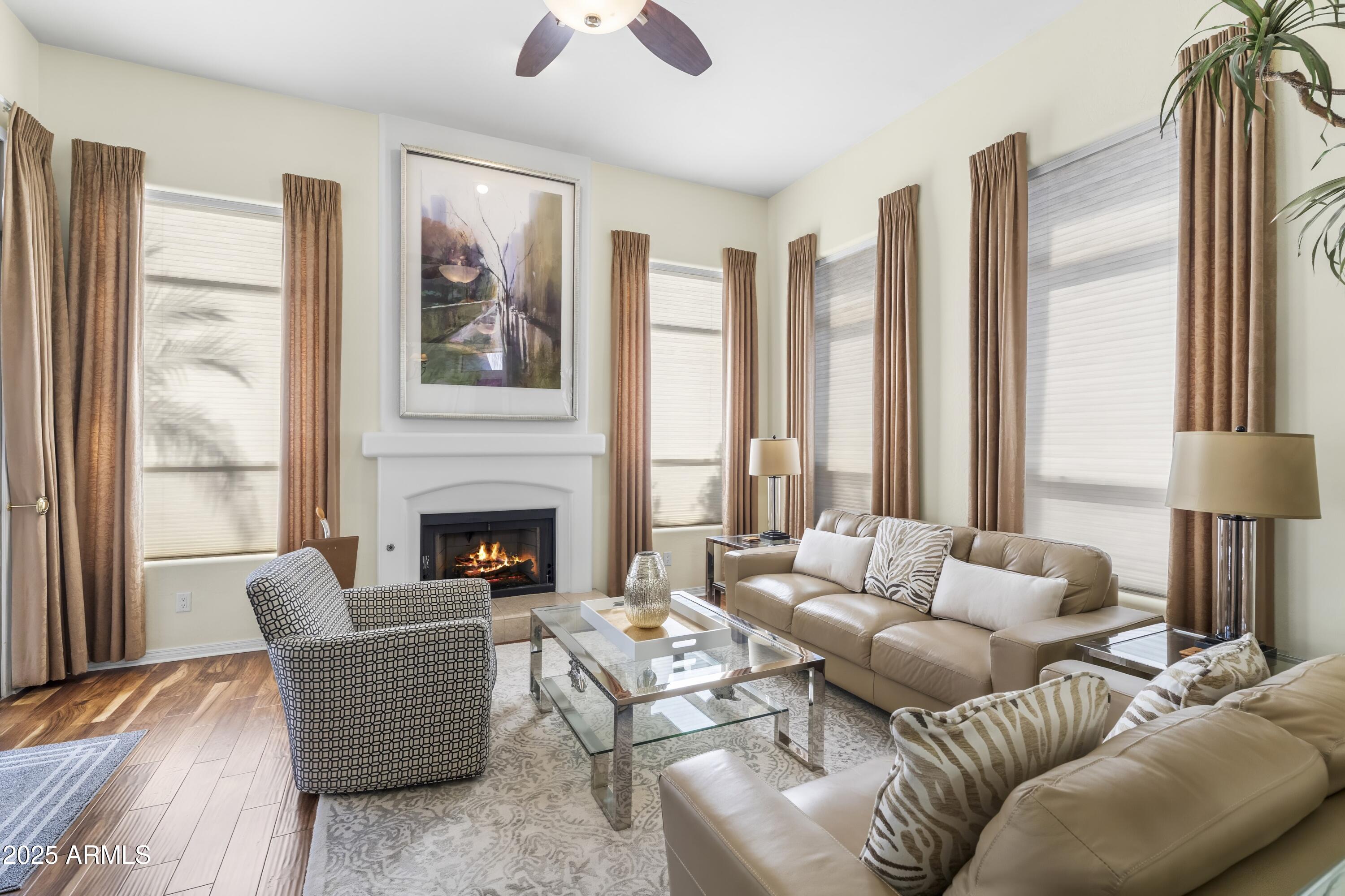 7267 East Vaquero Drive Scottsdale, AZ 85253 - Photo 12 of 37 a living room with furniture and a large window