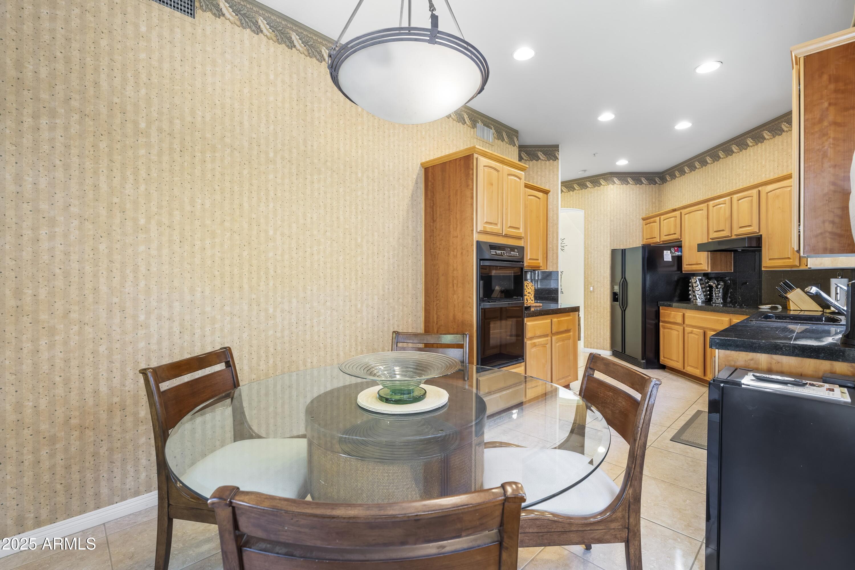 7267 East Vaquero Drive Scottsdale, AZ 85253 - Photo 16 of 37 a view of a dining room with furniture
