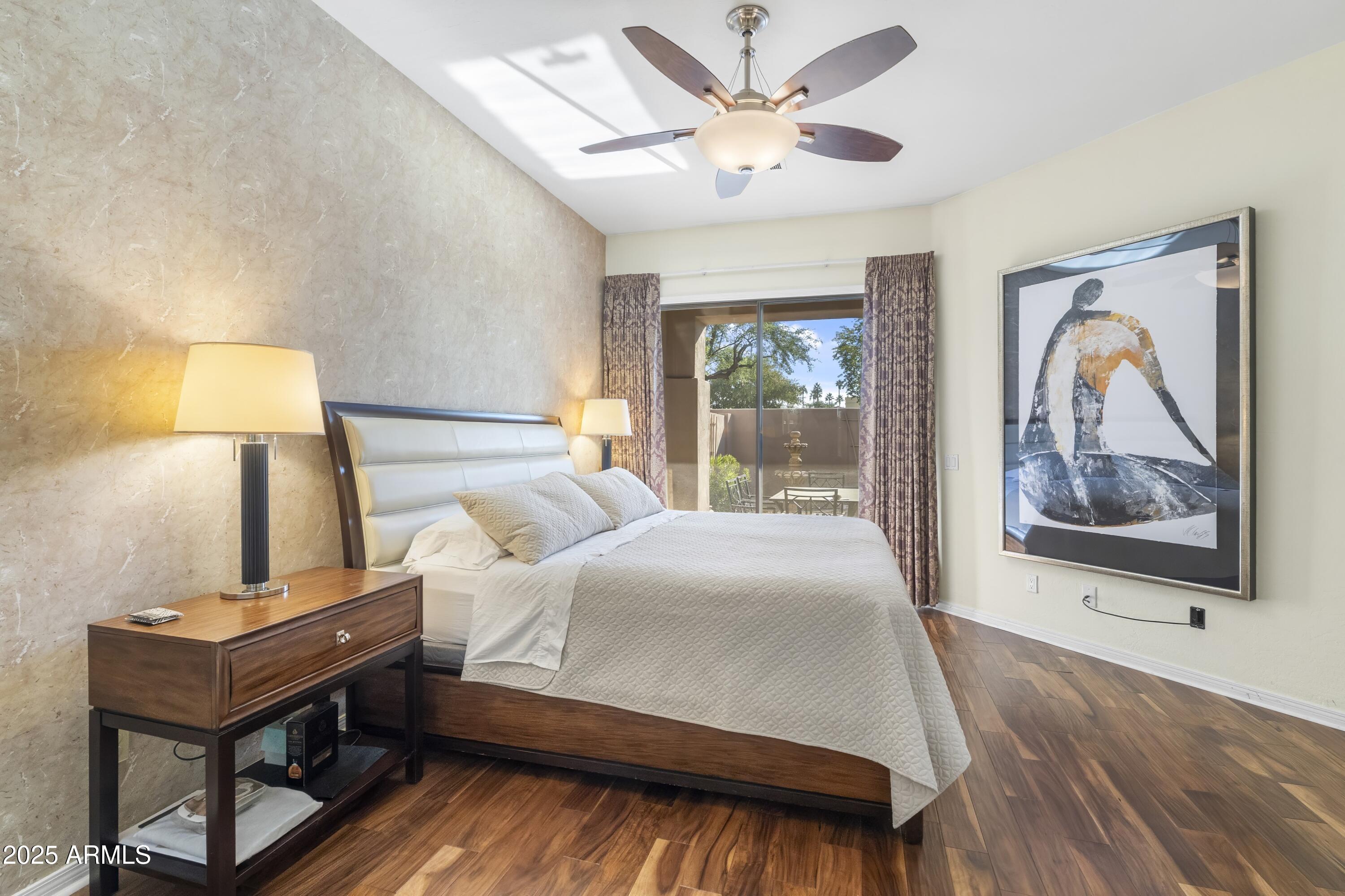 7267 East Vaquero Drive Scottsdale, AZ 85253 - Photo 18 of 37 a bedroom with a bed wall painting and a window