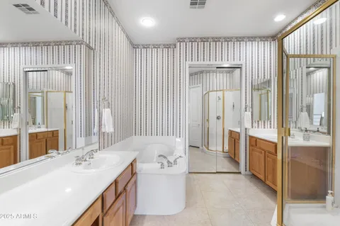 a bathroom with a bathtub and a sink