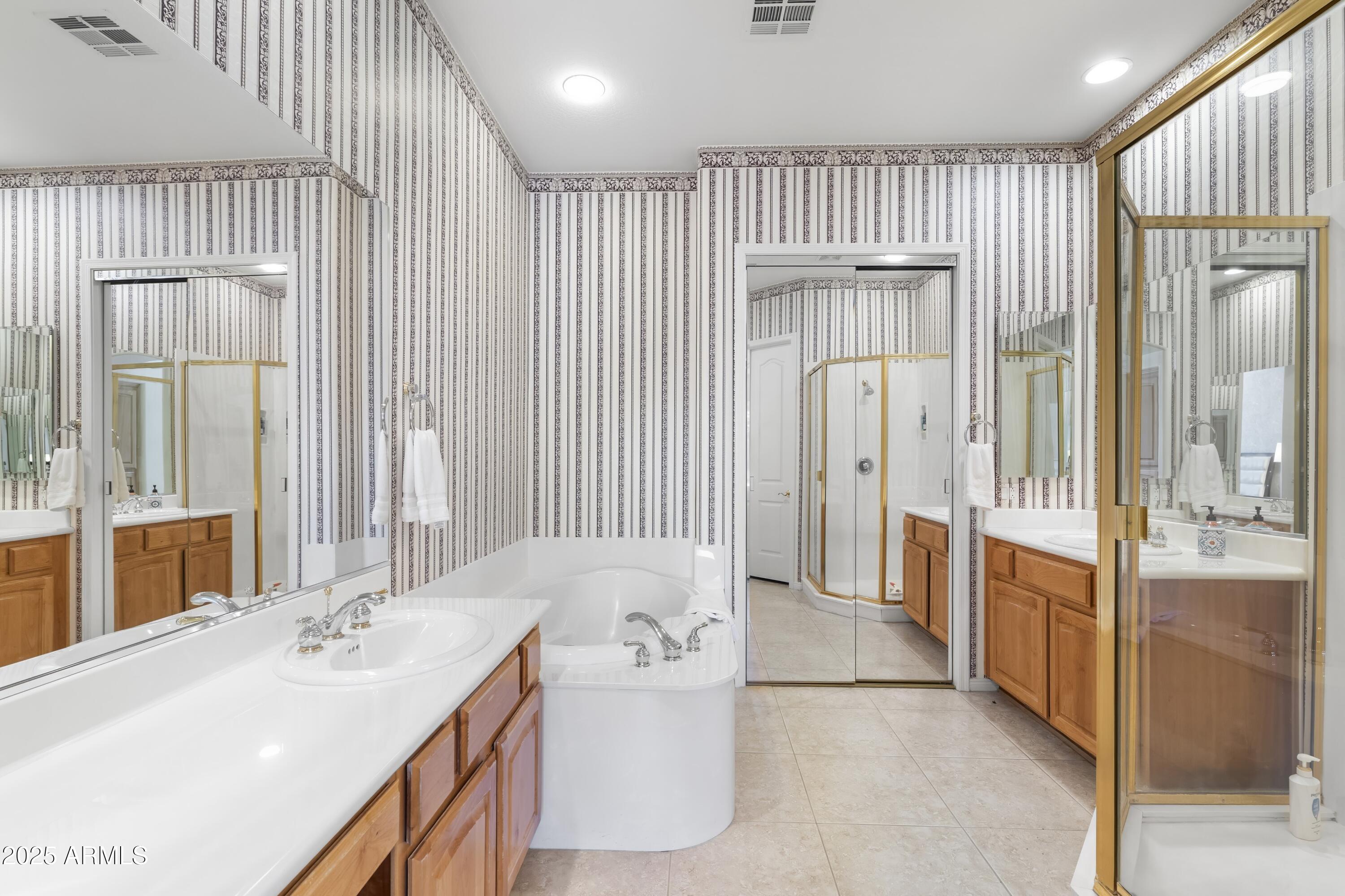 7267 East Vaquero Drive Scottsdale, AZ 85253 - Photo 20 of 37 a bathroom with a bathtub and a sink