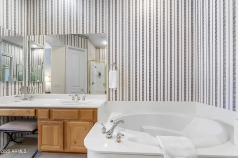 a bathroom with a bathtub and a sink