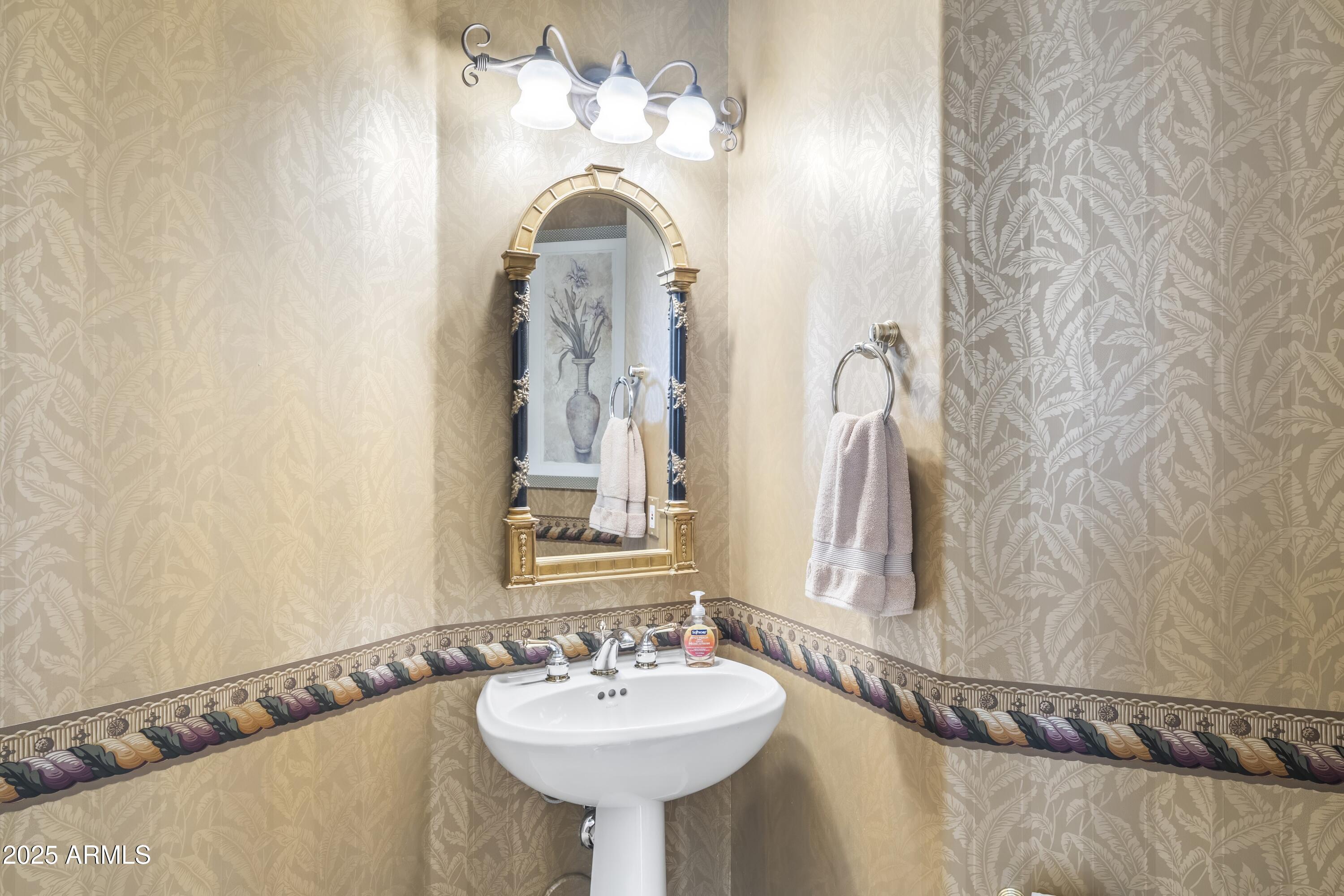 7267 East Vaquero Drive Scottsdale, AZ 85253 - Photo 24 of 37 a bathroom with a sink and a mirror