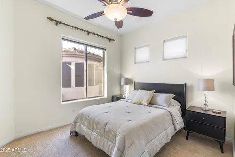 a bedroom with a bed and window