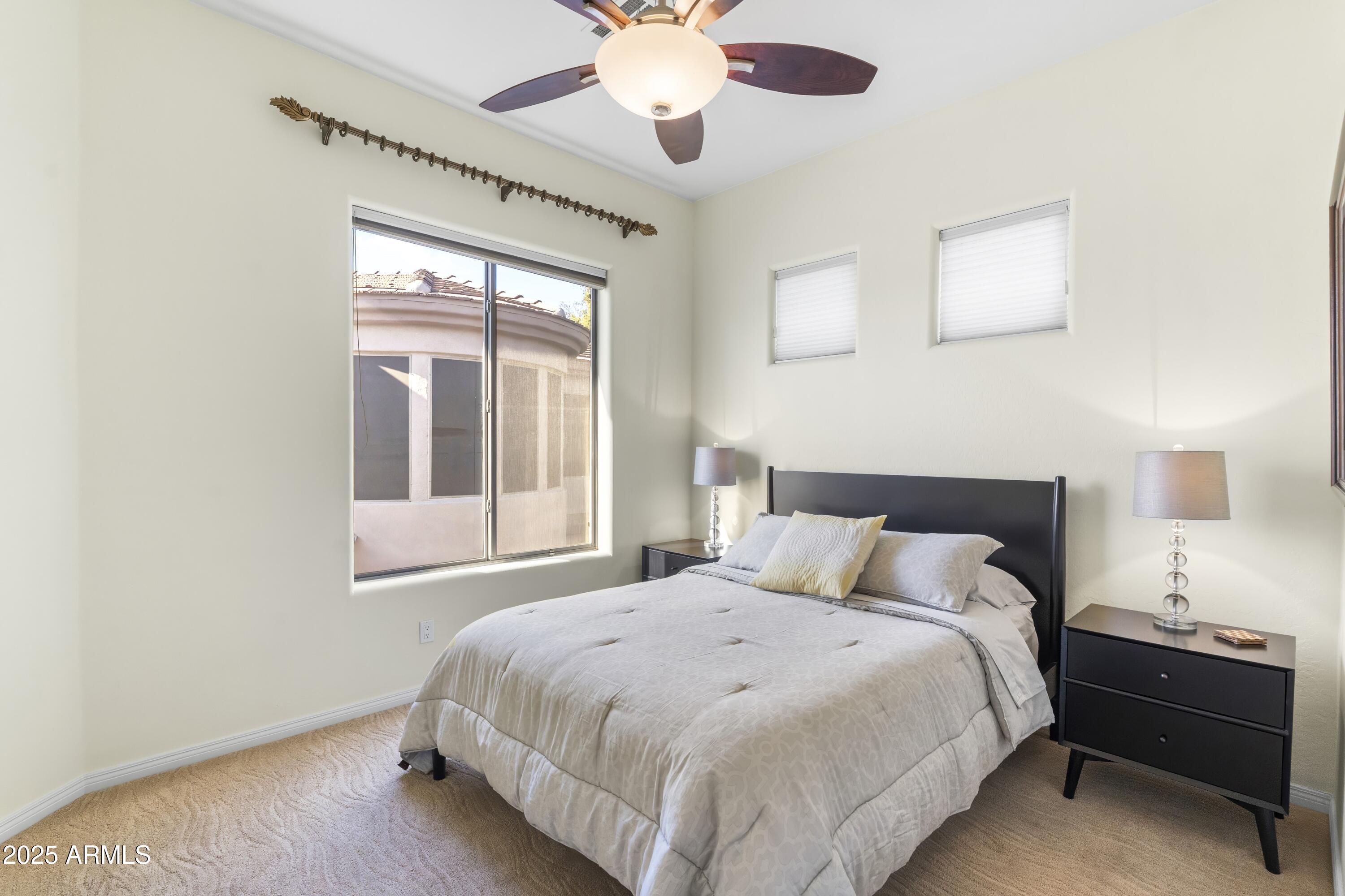 7267 East Vaquero Drive Scottsdale, AZ 85253 - Photo 28 of 37 a bedroom with a bed and window
