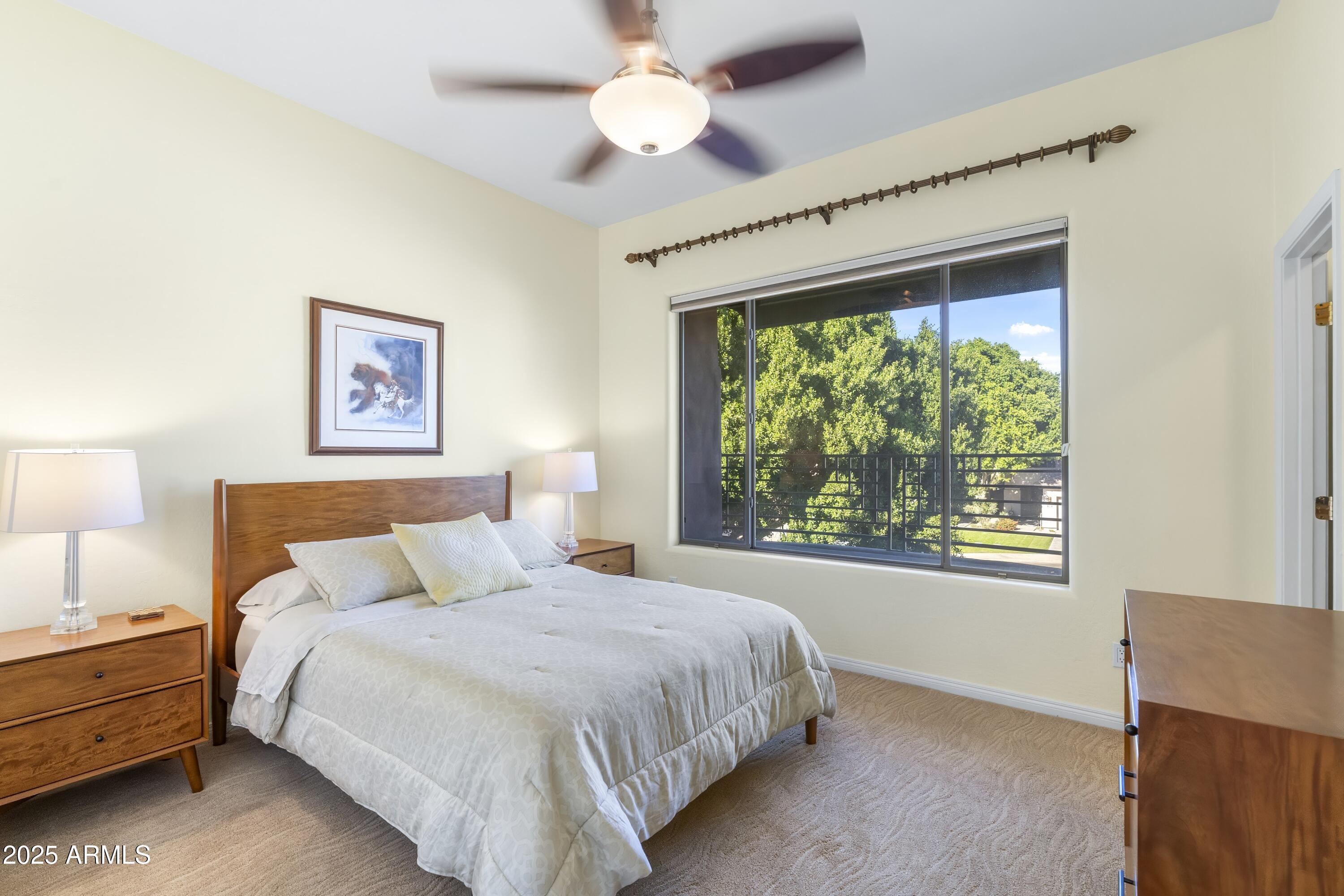 7267 East Vaquero Drive Scottsdale, AZ 85253 - Photo 31 of 37 a bedroom with a large bed and a window
