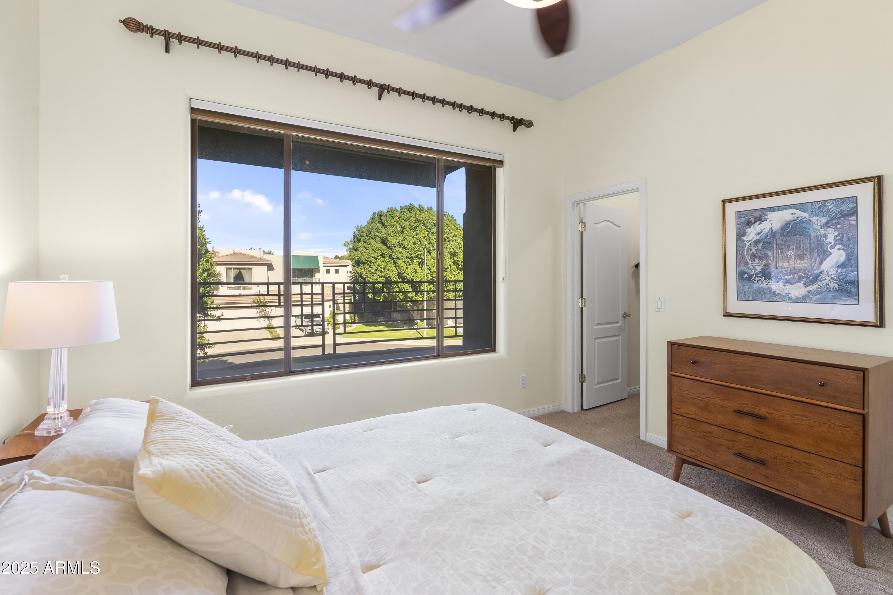 7267 East Vaquero Drive Scottsdale, AZ 85253 - Photo 32 of 37 a bedroom with a bed and a window