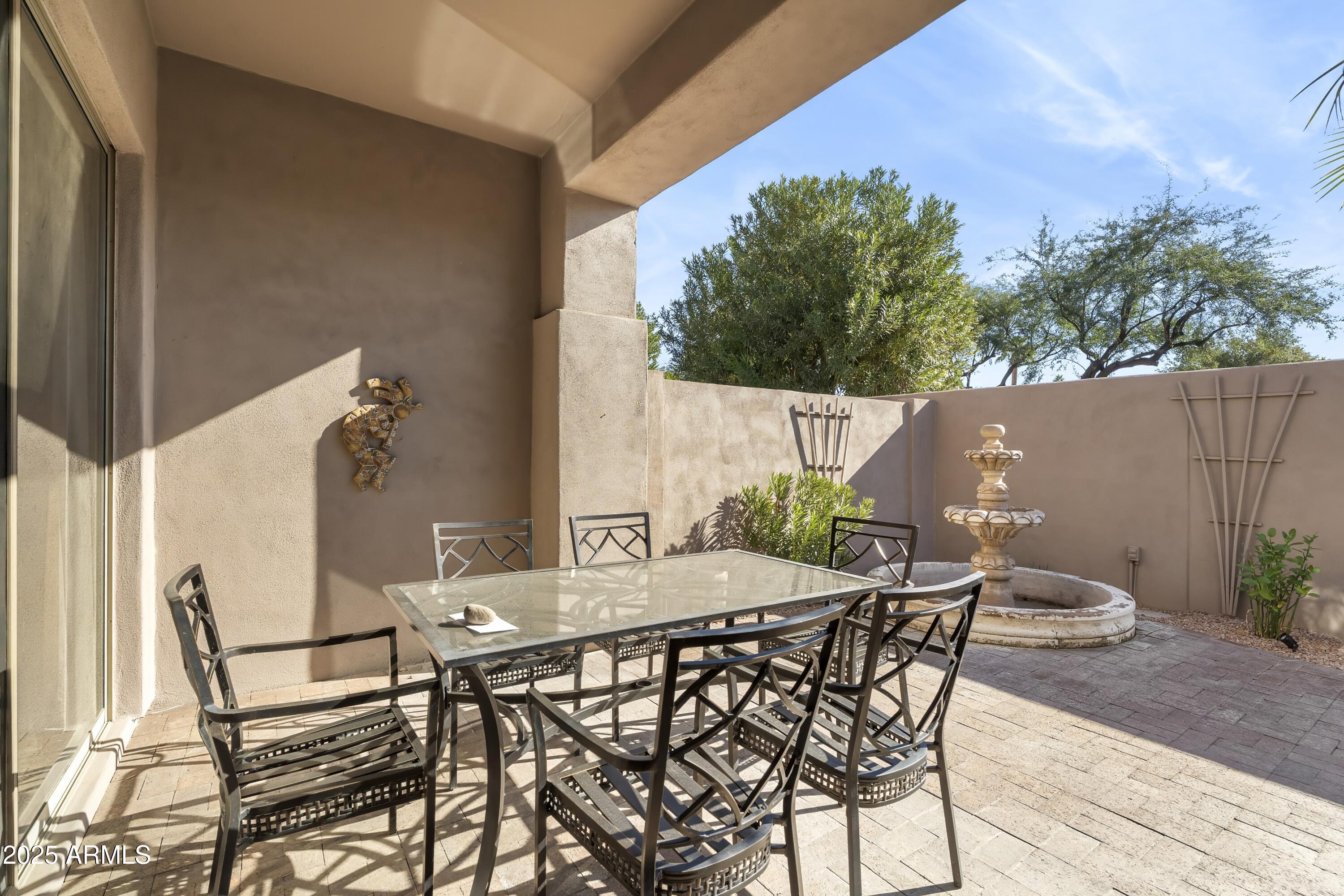 7267 East Vaquero Drive Scottsdale, AZ 85253 - Photo 34 of 37 a view of an outdoor space with table and chairs