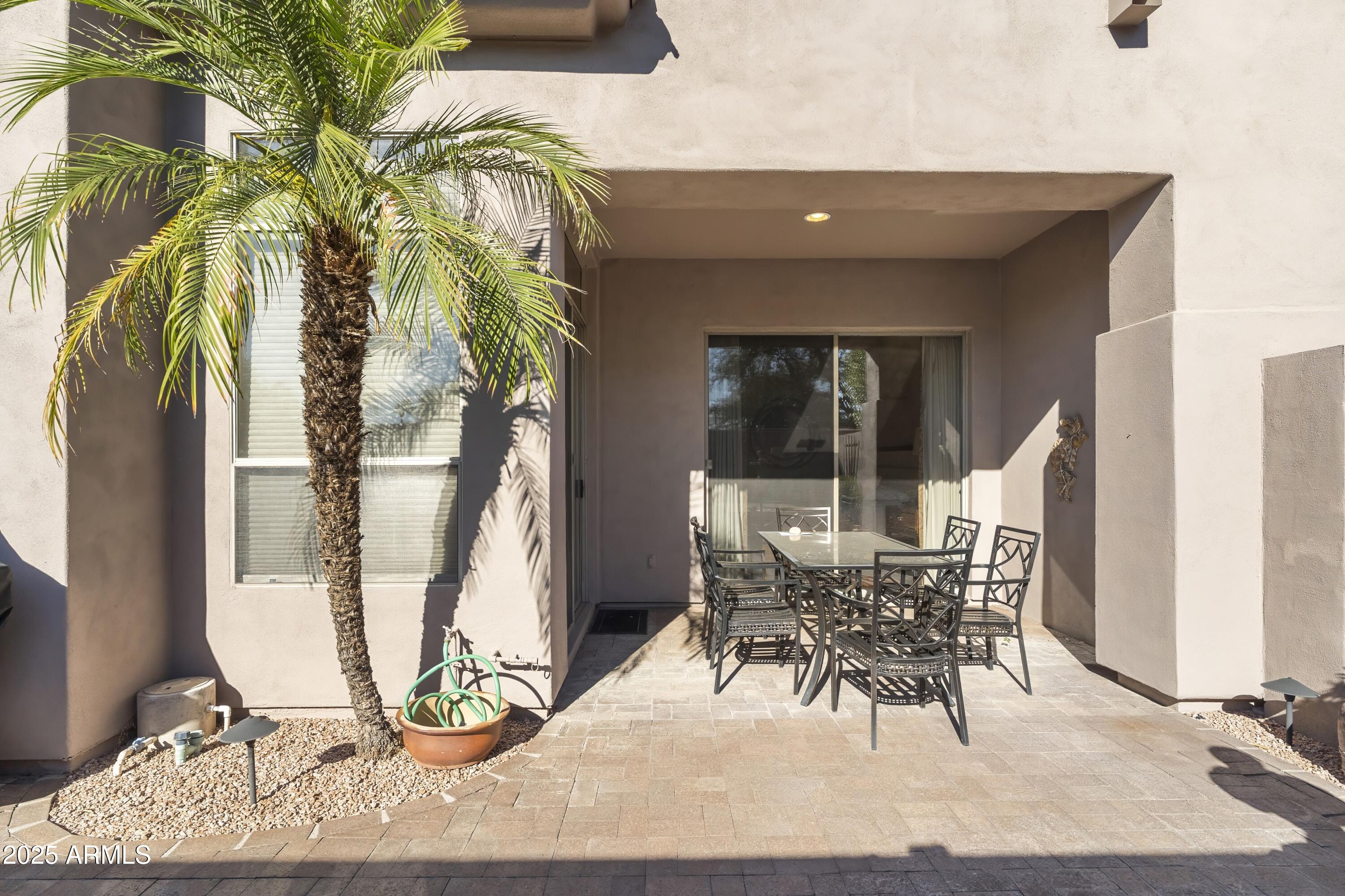 7267 East Vaquero Drive Scottsdale, AZ 85253 - Photo 36 of 37 a view of a dining room with a table and chairs