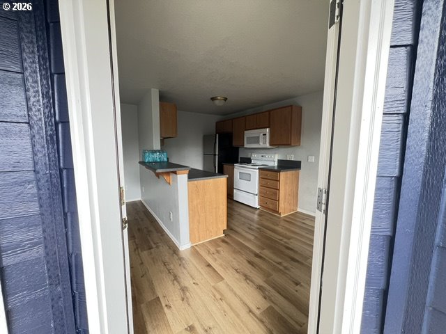 659 Northeast 162nd Avenue, Unit 302 Portland, OR 97230 - Photo 14 of 17 a view of a kitchen from the hallway