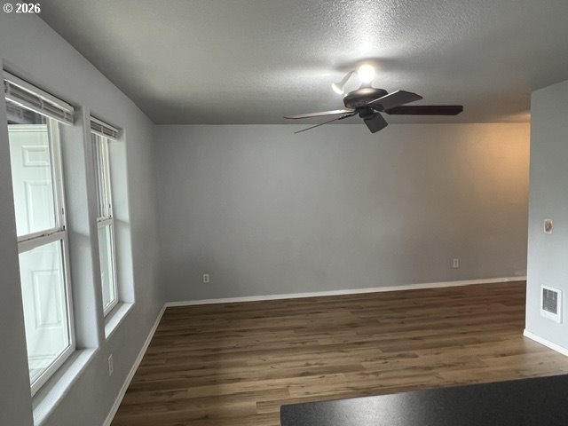 659 Northeast 162nd Avenue, Unit 302 Portland, OR 97230 - Photo 6 of 17 a view of room with window and hardwood floor