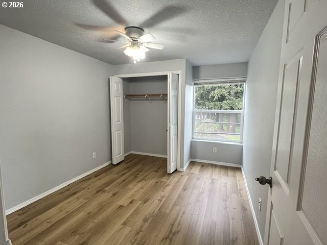 659 Northeast 162nd Avenue, Unit 302 Portland, OR 97230 - Photo 9 of 17 wooden floor in an empty room with a window
