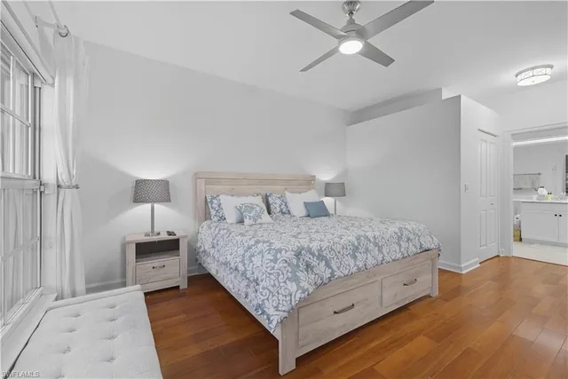 a bedroom with a bed and a lamp