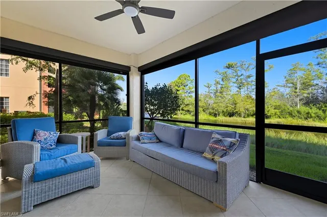 a living room with couch and a large window